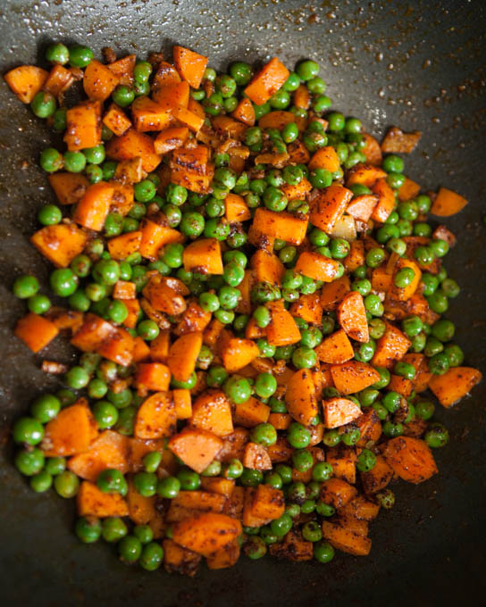 Saute carrots and peas for fried rice